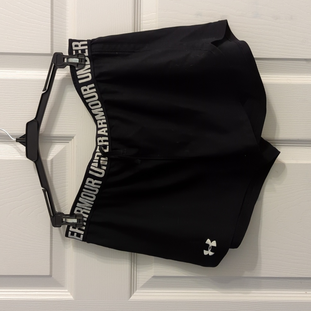 Under Armour black medium training shorts.